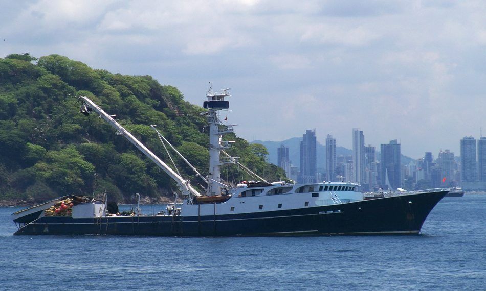 Large purse seine net being loaded onto research vessel, Cordova